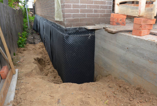 Happy homeowners after waterproofing job in Fulton